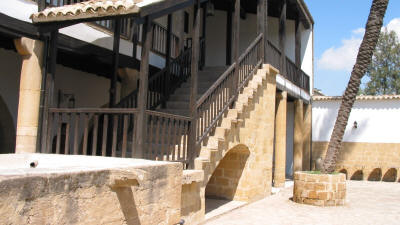 The courtyard and stairs to the wooden veranda at the Lusignan house, Nicosia, North Cyprus