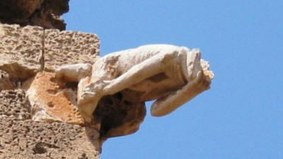 A gargoyle in the forfm of a monk